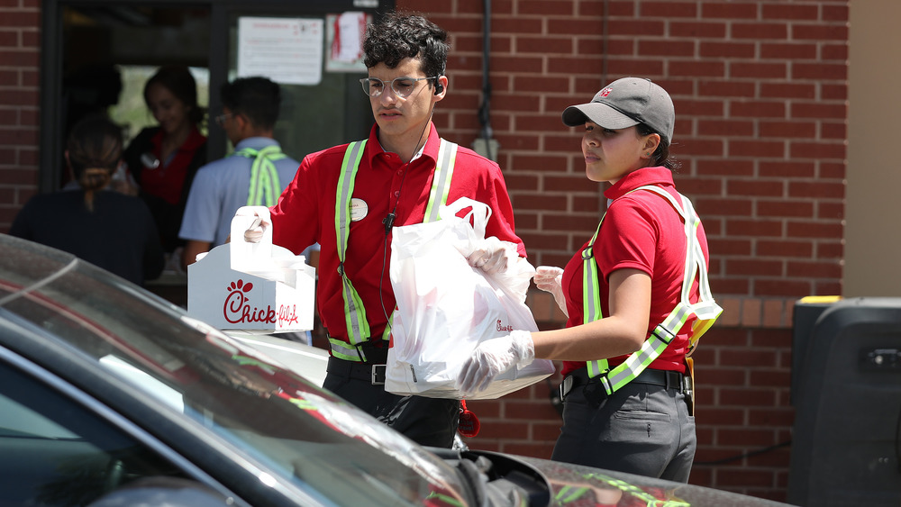 chick-fil-a workers at the drive-through