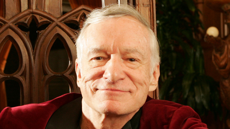 Hugh Hefner sitting in chair