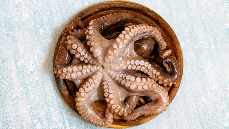 Octopus on wooden dish