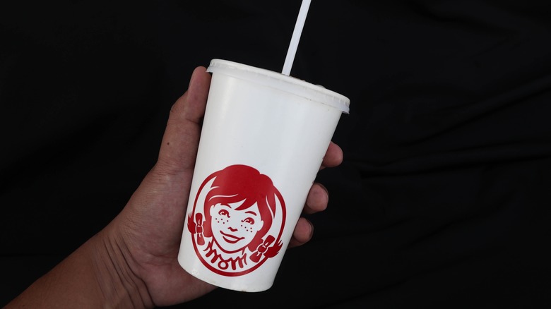 Person holding a Wendy's beverage