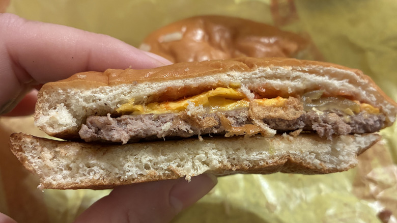 McDonald's cheeseburger in half