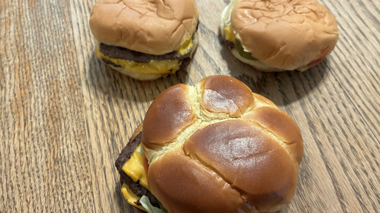 Wendy's trio of cheeseburgers on a table