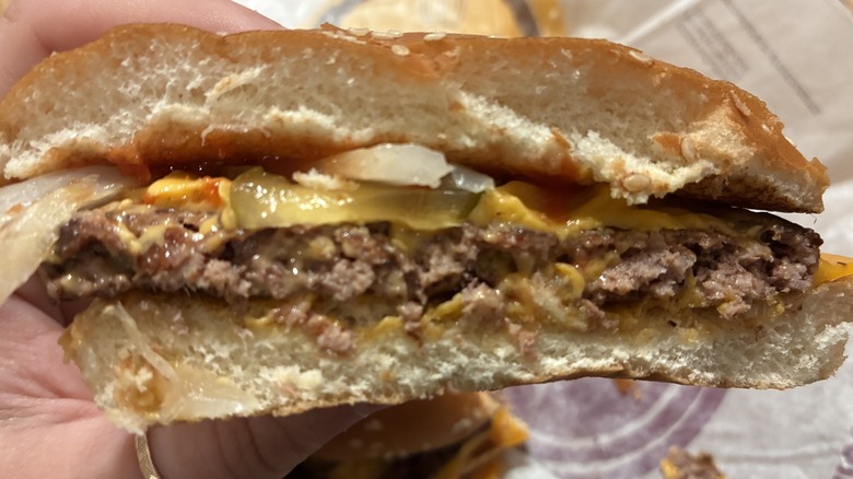 Half of McDonald's Quarter Pounder with cheese and pickles