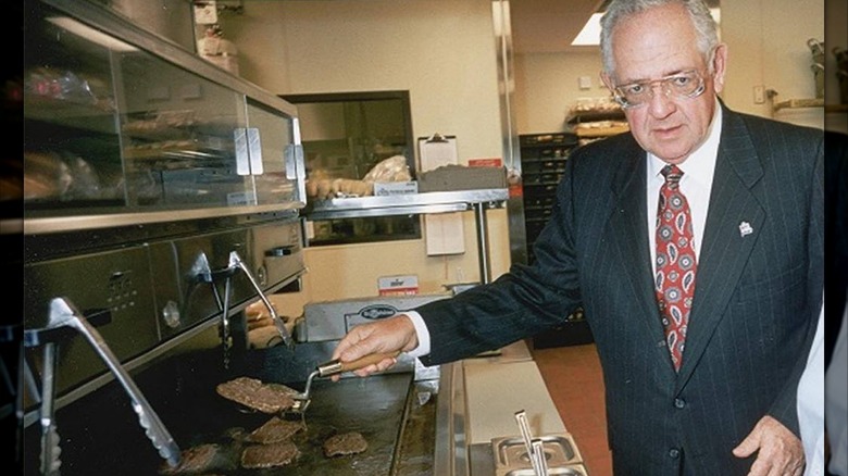 Dave Thomas flips burgers in a Wendy's kitchen