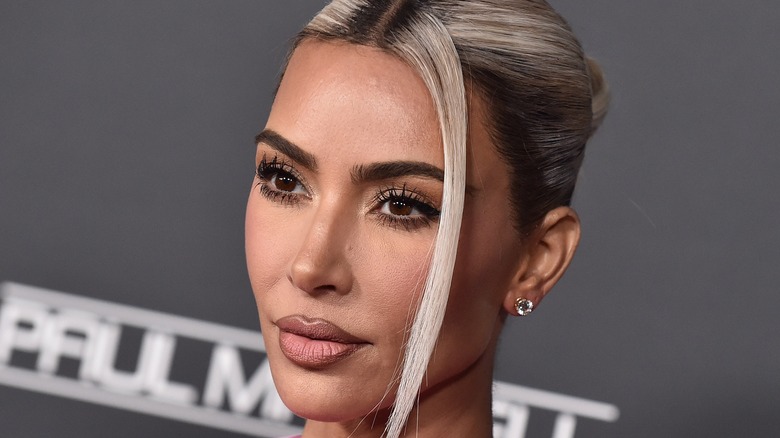 Kim Kardashian on gray background