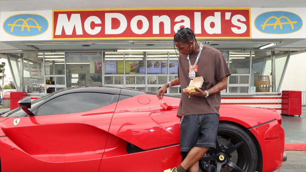 Travis Scott outside of McDonald's with Cactus Jack meal