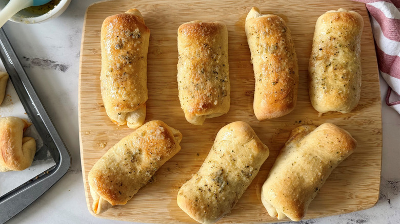 Pepperoni rolls on wooden board