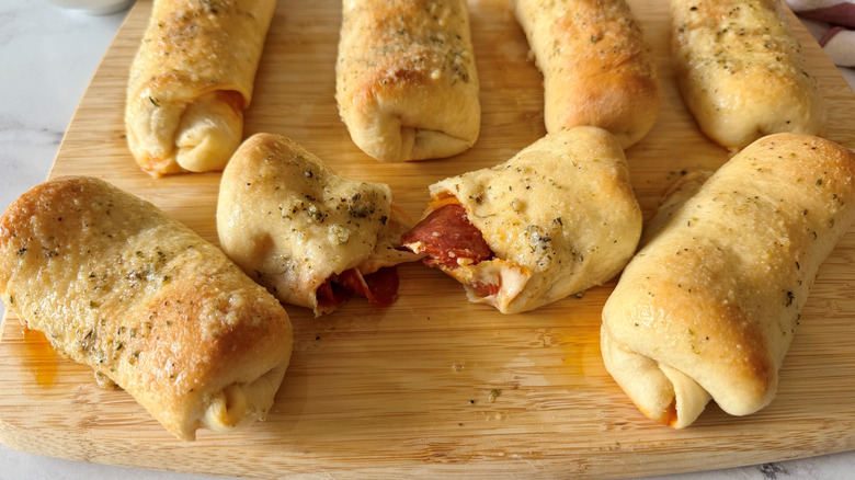Pepperoni rolls on wooden board