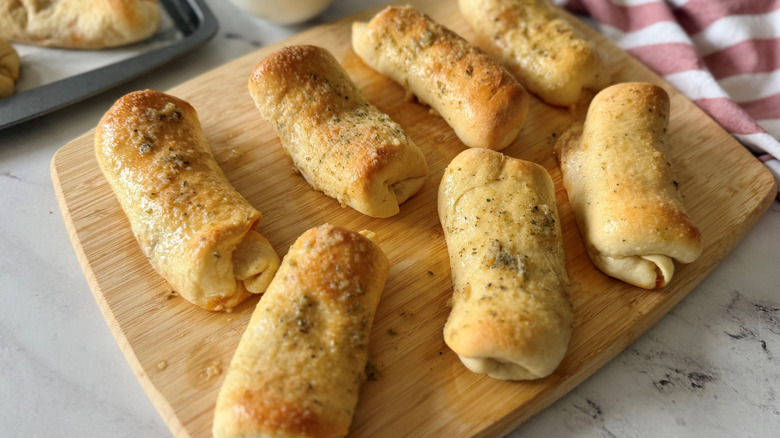 Pepperoni rolls on wooden board