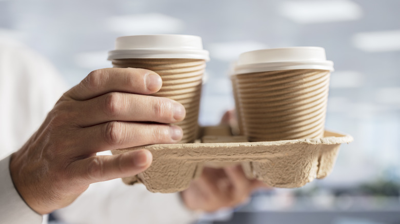 Hot drink carrier with take-out cups in it