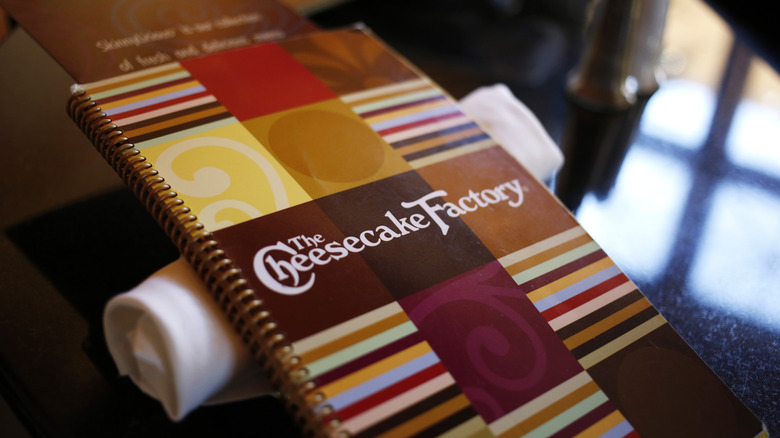 Cheesecake Factory menu on a table