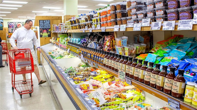 Man shopping with cart in frozen section at Trader Joe's