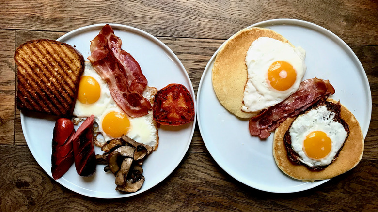 Australian fry-up with eggs, bacon, and tomatoes