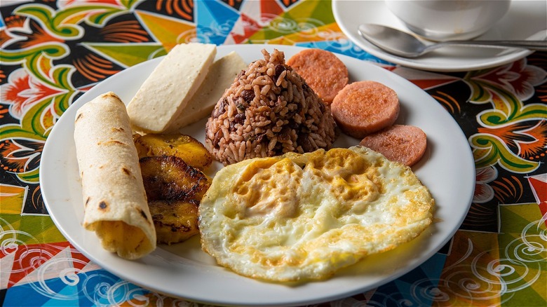 Plate with eggs, rice, meat, and tortilla