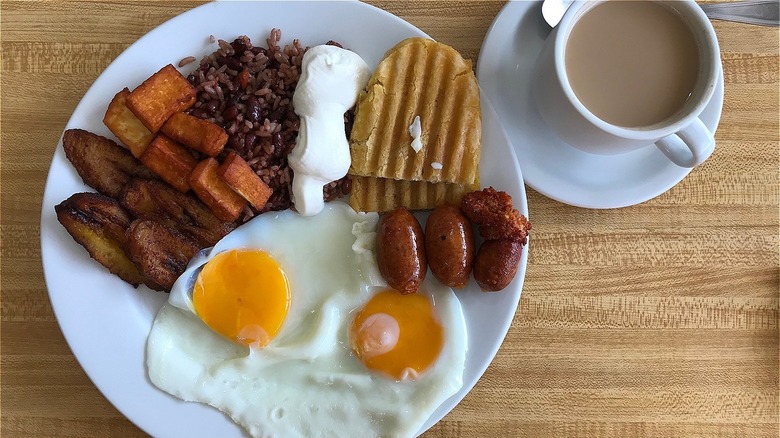 Nicaraguan breakfast with gallo pinto, eggs, plantains, and tortillas