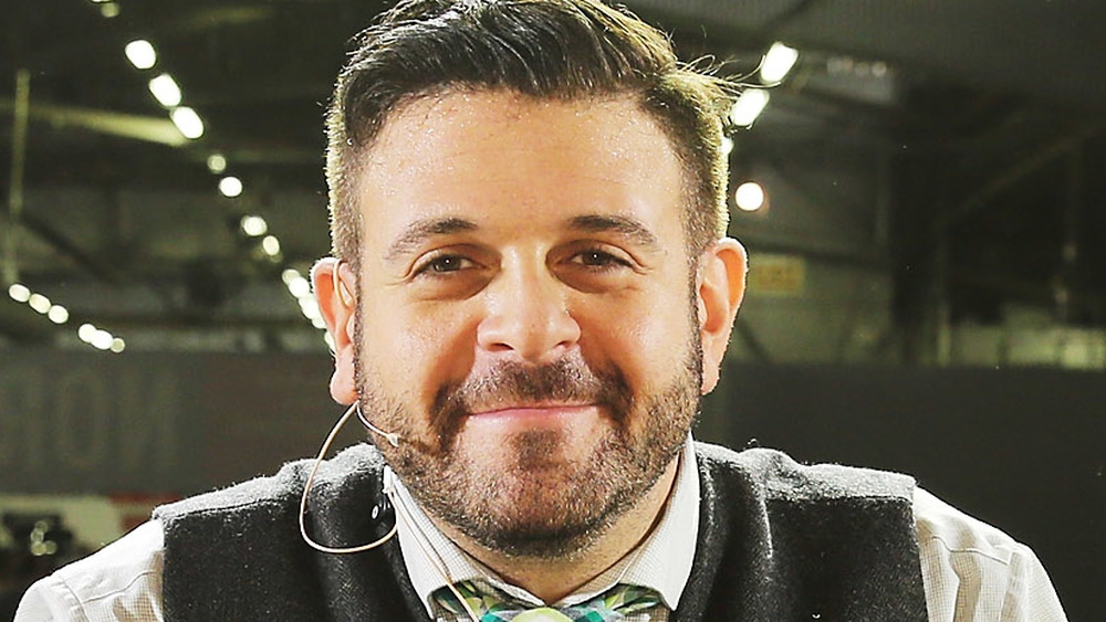 Adam Richman smiling of stage