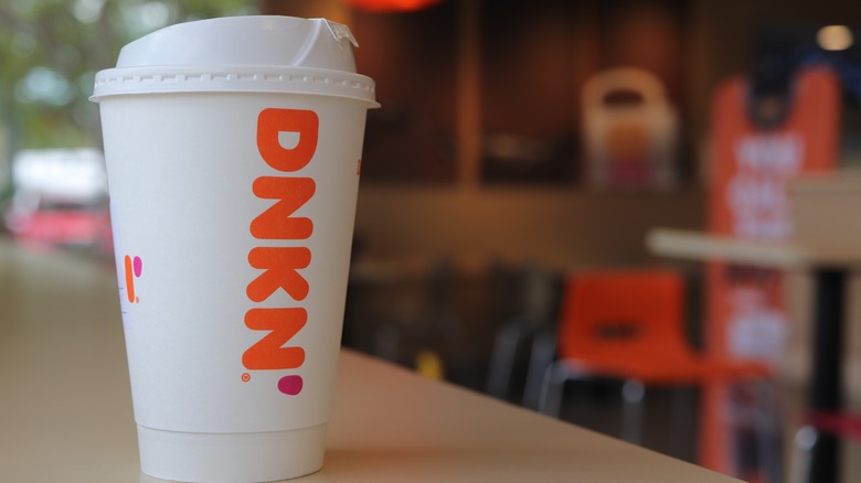 Dunkin coffee cup on a table