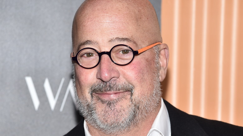 Andrew Zimmern in black and orange glasses