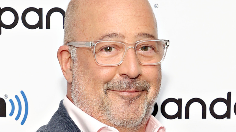 Andrew Zimmern smiling at event 