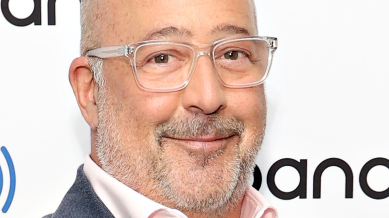 Andrew Zimmern with clear glasses