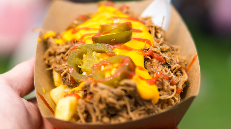 Pulled pork covered in cheese and sauce