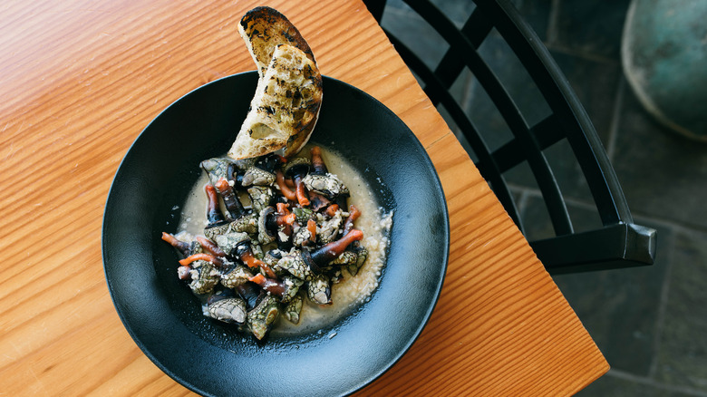 Gooseneck barnacles in a black dish