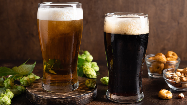 Glasses of light and dark beer side-by-side