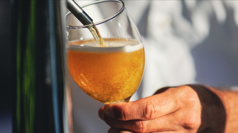 An American wheat beer being poured from the tap.
