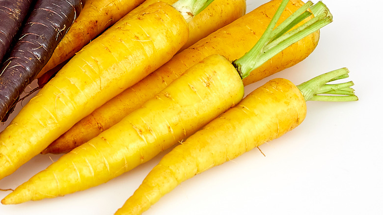 Yellow carrots on a white background