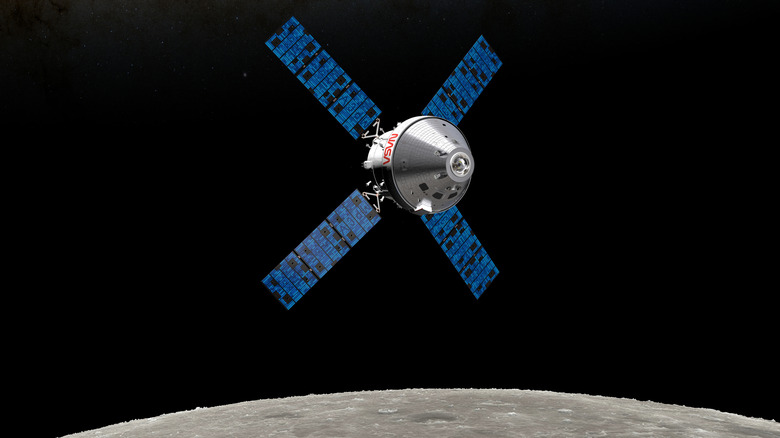 Orion spaceship orbiting moon.