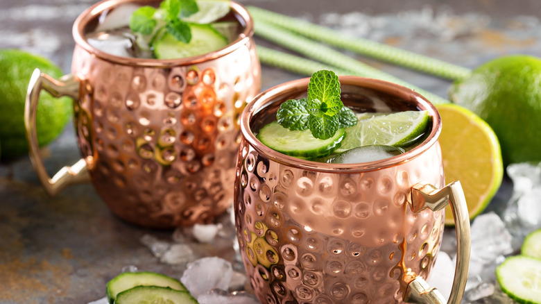 Moscow Mules garnished with mint in copper mugs