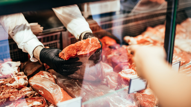 Customer at meat counter