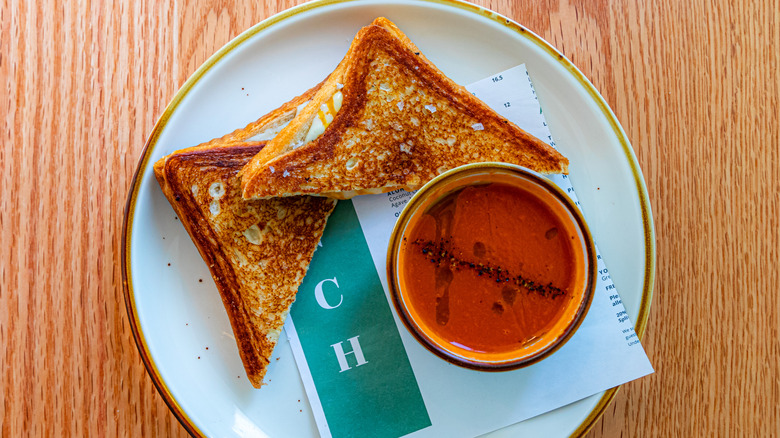 a grilled cheese sandwich with tomato soup