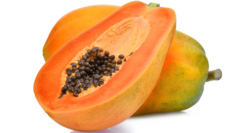 A fresh papaya cut in half