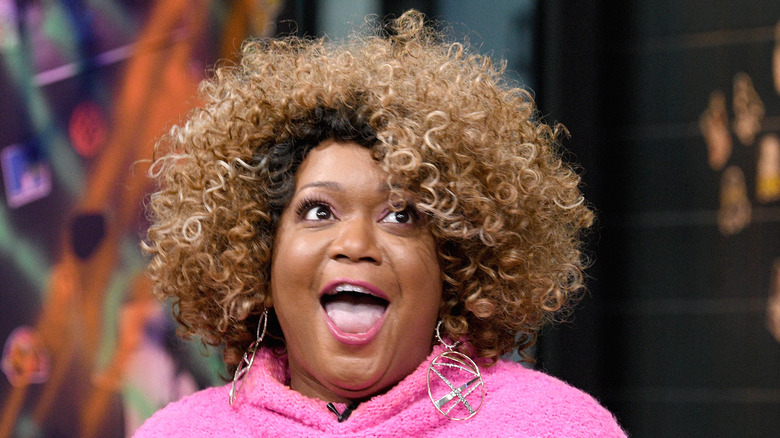 Sunny Anderson in pink sweater 