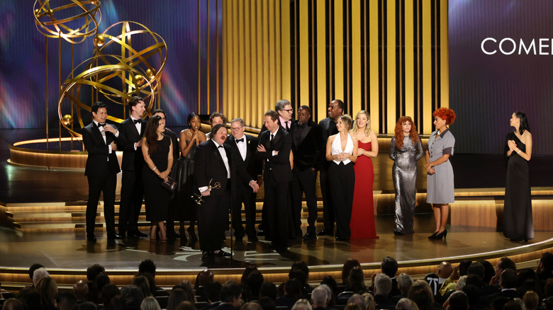 The cast and crew of The Bear receives an award at The Primetime Emmy's