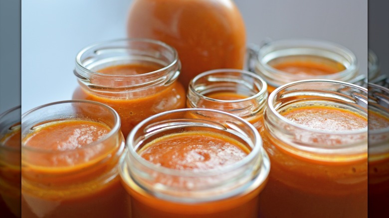 Jars filled with vegetable sauce