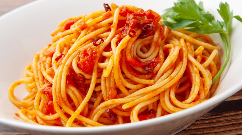 Spaghetti arrabbiata in white bowl