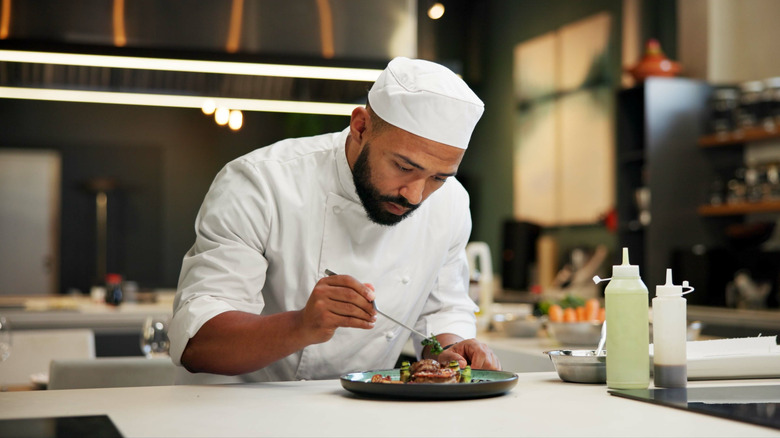 chef preparing elegant gourmet dish