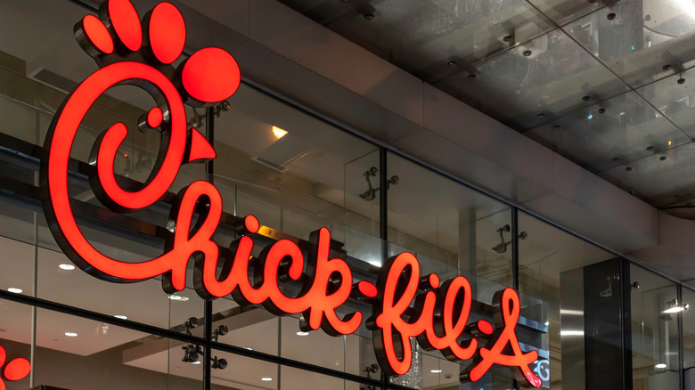 Red Chick-fil-A logo on glass building