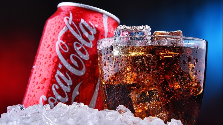 Coca-Cola can and glass of soda