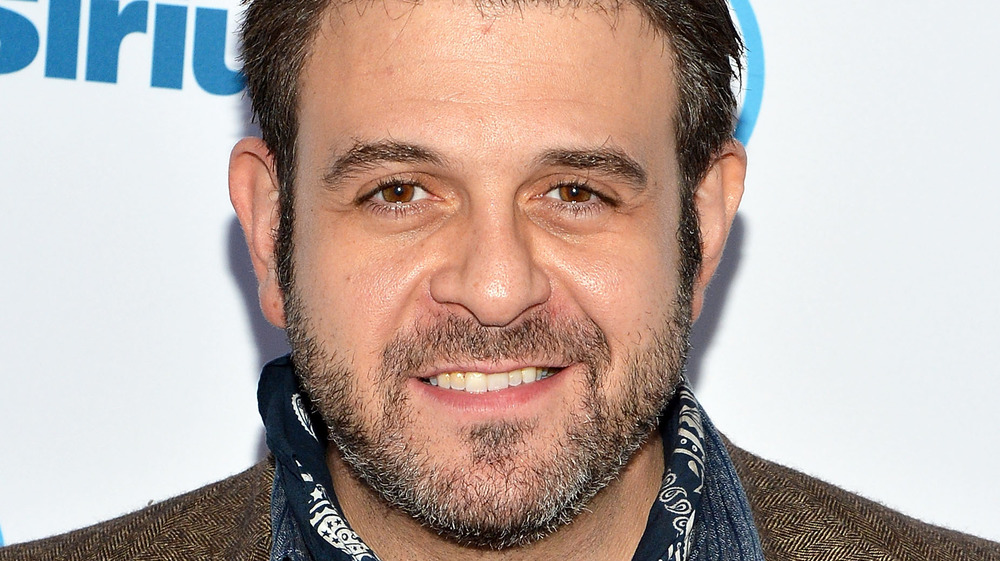 Adam Richman wearing handkerchief around neck