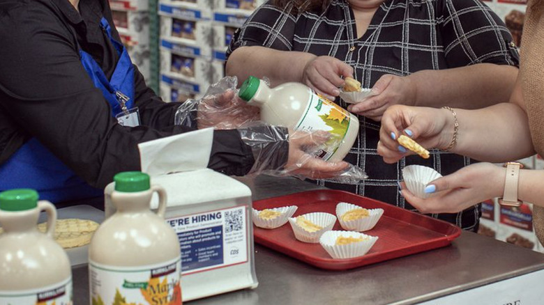 two women tasting costco samples