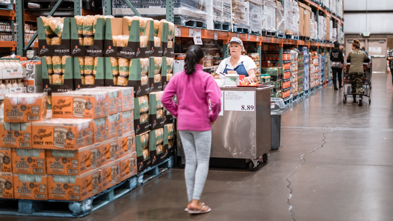 customer talking to costco sample employee