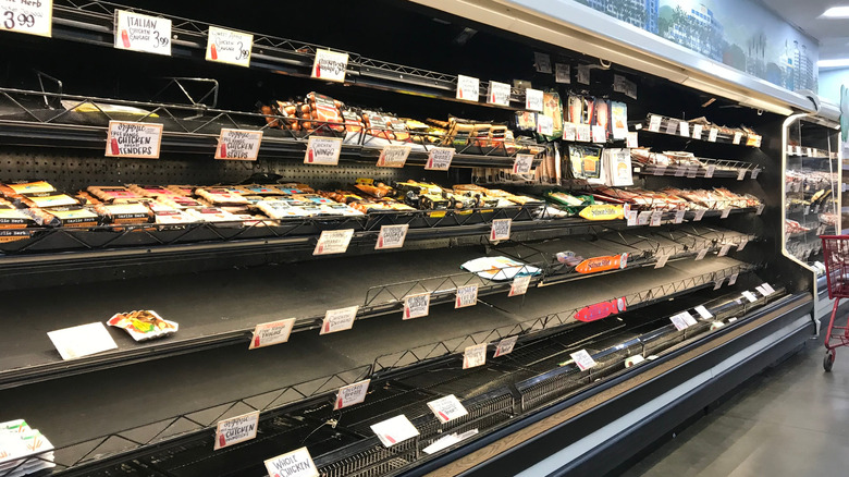 Nearly empty meat shelves at Trader Joe's grocery store