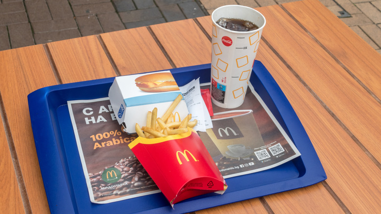 Filet-O-Fish meal on a blue tray, consisting of one sandwich, large fries, and a drink