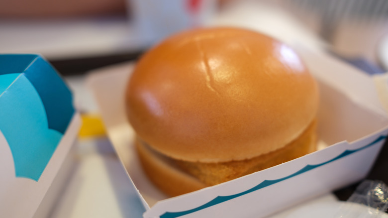 Close-up shot of the shiny steamed bun of a Filet-O-Fish