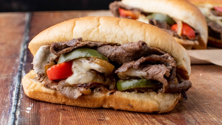 Philly cheesesteak on wooden table