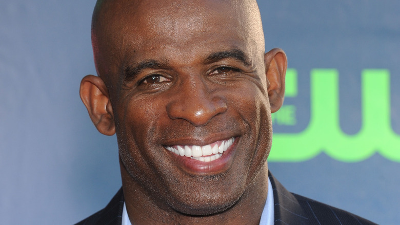 Deion Sanders smiling at event