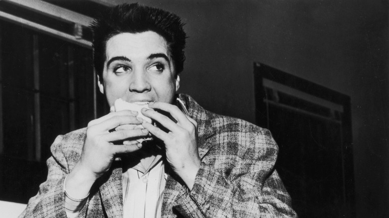 Elvis eating a sandwich